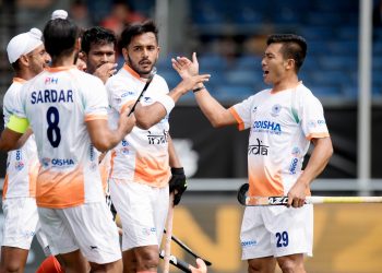 Teammates congratulate Harmanpreet Singh (C) after he scored the first goal for India against Argentina in their Champions Trophy group encounter, Sunday   