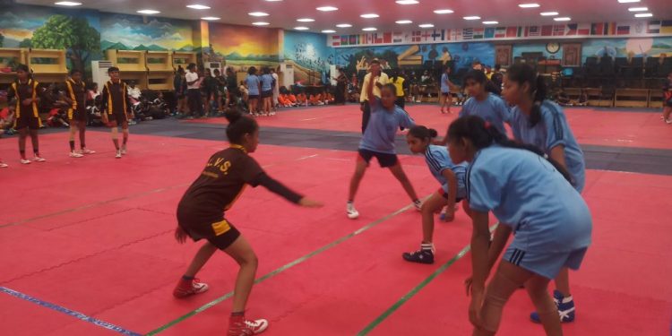 Bhubaneswar and Raipur players in action during their kabaddi match in Bhubaneswar, Friday