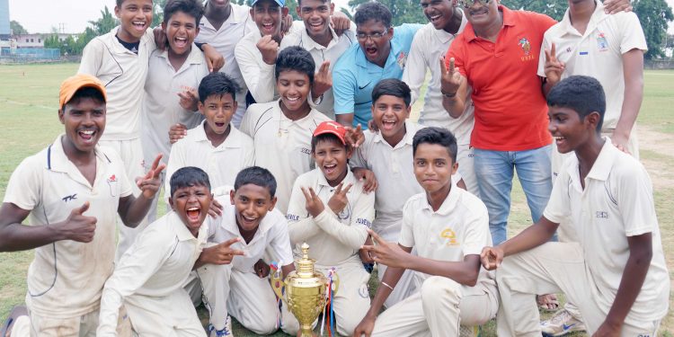 Cuttack-A players and officials pose with the winners’ trophy at Cuttack, Friday     