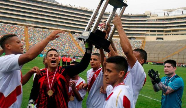 Unique competition: Peru players celebrate with the Prisoners’ World Cup trophy at Lima