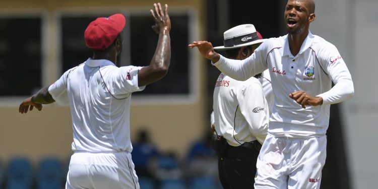 West Indies’ Roston Chase (R) celebrates with teammates after dismissing a Sri Lanka batsman at Port of Spain, Sunday