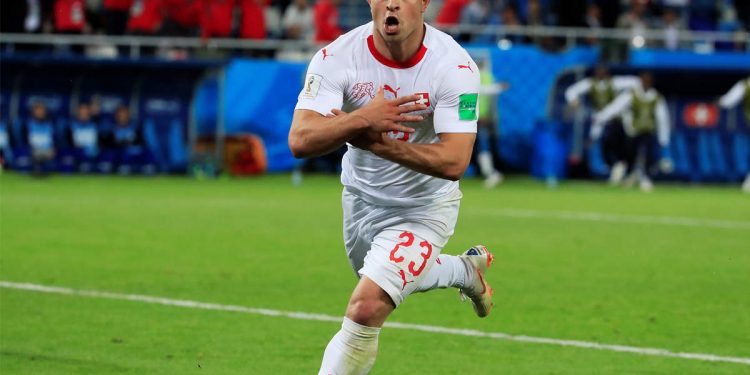 Xherdan Shaqiri celebrates after netting the winner against Serbia, Friday