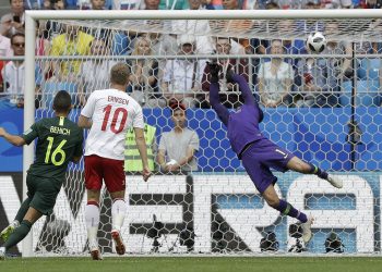 Christian Eriksen of Denmark watches as his stunning volley beats the Aussie shotstopper to give his side the lead at Samara, Thursday