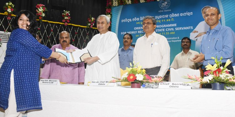 Chief Minister Naveen Patnaik hands over appointment Letter to a newly-recruited Odisha Civil Services Officer at Soochana Bhawan, Saturday