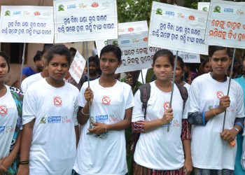 Girls participate in a dengue awareness rally at Salia Sahi slum in Bhubaneswar, Tuesday.