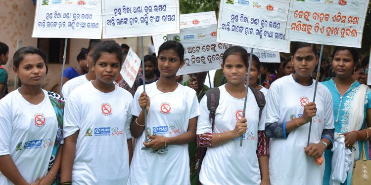 Girls participate in a dengue awareness rally at Salia Sahi slum in Bhubaneswar, Tuesday.