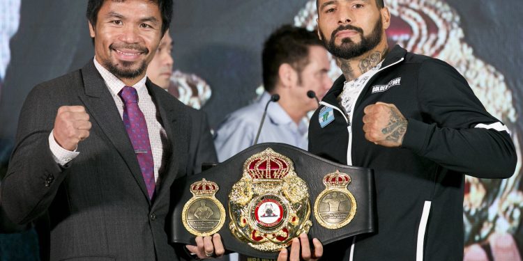 Philippine senator and boxing hero Manny Pacquiao (L) poses with Argentine WBA welterweight champion Lucas Matthysse during a press conference, in Kuala Lumpur, Malaysia