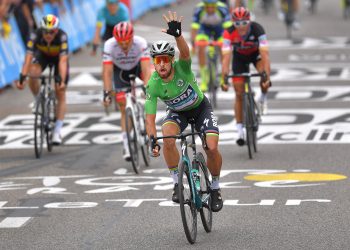 Peter Sagan (in green) celebrates as he crosses that finishing line to win the 13th stage of Tour de France, Friday