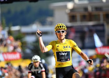 Geriant Thomas celebrates as he crosses the finish line to win the 12th stage of the Tour de France, Friday