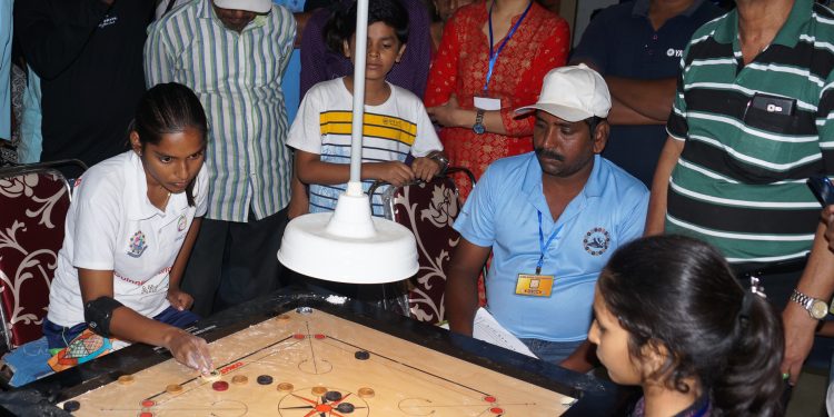 Participants in action during the All India Invitational Carrom Tournament at Cuttack, Friday     