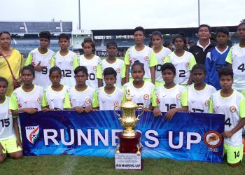 Odisha players pose with the runners-up trophy at Cuttack, Thursday         