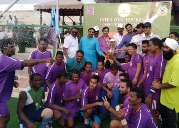 Central Zone A players pose with their winners’ trophy along with guests in Bhubaneswar, Saturday   