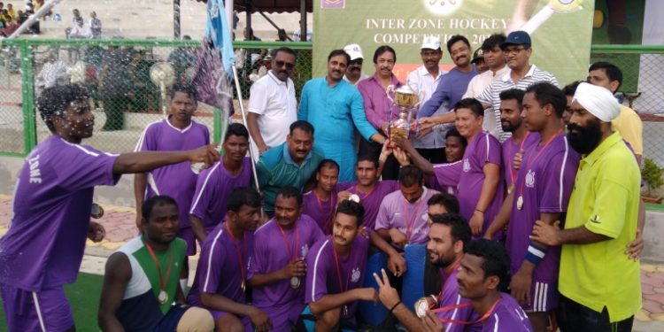 Central Zone A players pose with their winners’ trophy along with guests in Bhubaneswar, Saturday   