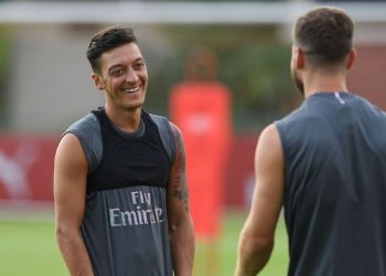 Mesut Ozil has something to laugh about during Arsenal's training session in Singapore