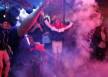 Parisians celebrate after France’s win over Belgium in the World Cup semifinals