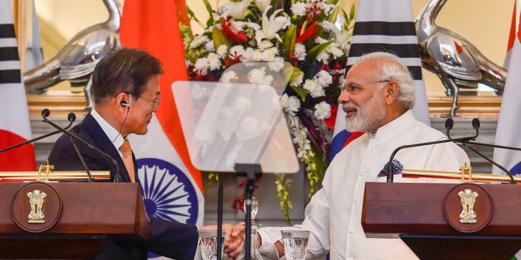 New Delhi: Prime Minister Narendra Modi shakes hands with South Korean President Moon Jae-in after their joint press conference at Hyderabad House, in New Delhi on Tuesday, July 10, 2018. (PTI Photo/Kamal Singh)  (PTI7_10_2018_000116B)