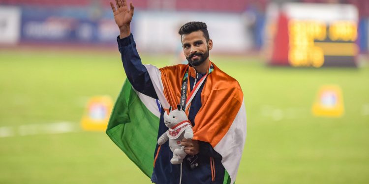 Arpinder Singh pose with the gold medal at Jakarta, Wednesday