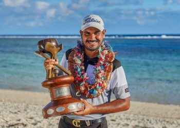 Gaganjeet Bhullar poses with the winner’s trophy at Natadola Bay, Fiji, Sunday  