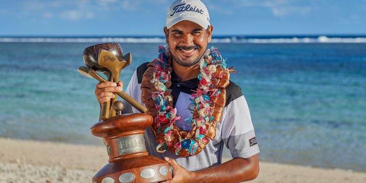 Gaganjeet Bhullar poses with the winner’s trophy at Natadola Bay, Fiji, Sunday  