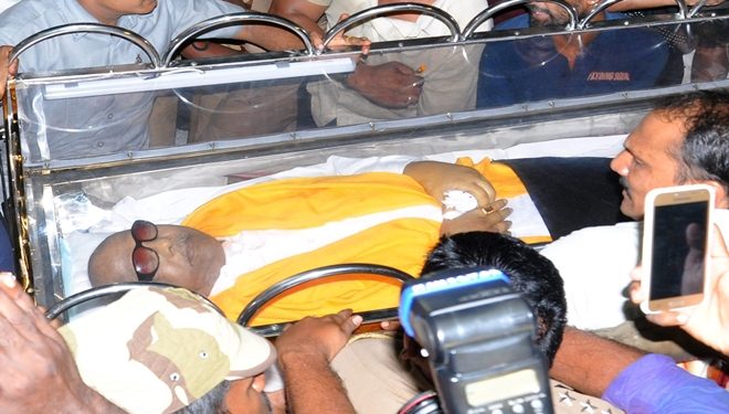 Chennai: Mortal remains of DMK chief M Karunanidhi carryout from ambulance after  reached his Gopalapuram residence, in Chennai, on Tuesday, Aug. 7, 2018.  (PTI Photo/R Senthil Kumar)(PTI8_7_2018_000337B)