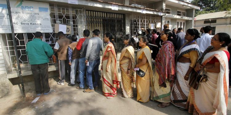 People queue outside NRC Seva Kendra to check names of themselves and family members in a draft for National Register of Citizens (NRC) in Guwahati on Monday.  PTI Photo (PTI1_1_2018_000061B)