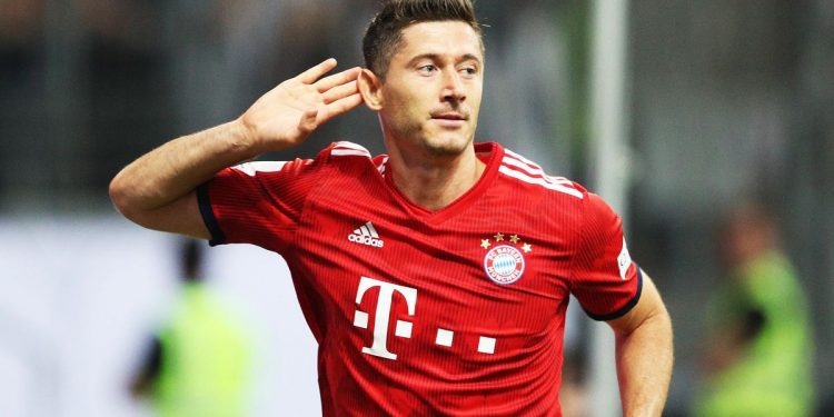 Robert Lewandowski celebrates after scoring one of his three goals against Eintracht Frankfurt