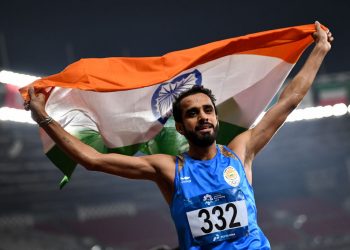 Manjit Singh of India celebrates victory after winning Men's 800m at the Asian Games