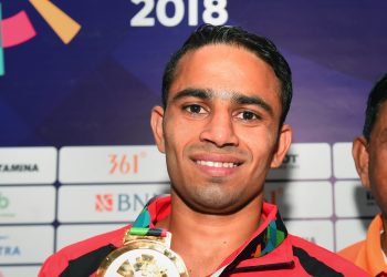 Gold-medallist India's Amit Panghal poses for photo after winning Men's light fly (46-49kg) boxing at the Asian Games