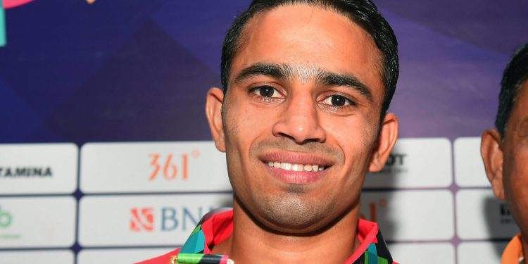 Gold-medallist India's Amit Panghal poses for photo after winning Men's light fly (46-49kg) boxing at the Asian Games