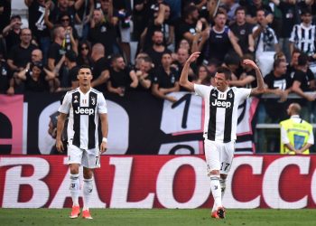 Cristiano Ronaldo (L) looks on as Mario Mandzukic celebrates after scoring against Napoli, Saturday