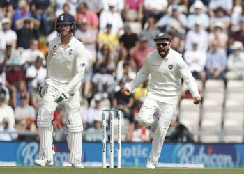 Virat Kohli (R) celebrates after England's Keaton Jennings was given out lbw off the bowling of Mohammed Shami during play on the third day of the 4th Test match