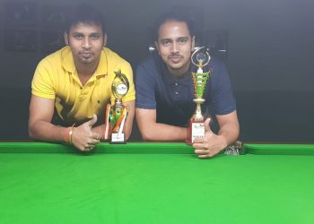 Akash Mohapatra (R) and Jiten Sarangi pose with their trophies at Bhubaneswar, Tuesday 