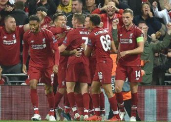 Liverpool players congratulate Roberto Firmino (facing James Milner) after scoring the winner against PSG at Anfield, Tuesday