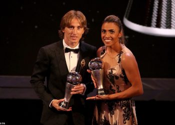 Luka Modric and Marta are all smiles as they pose with their FIFA best player trophies at London, Monday evening