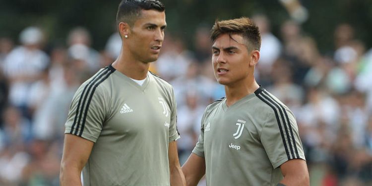 Cristiano Ronaldo (L) and Paulo Dybala during a Juventus training session