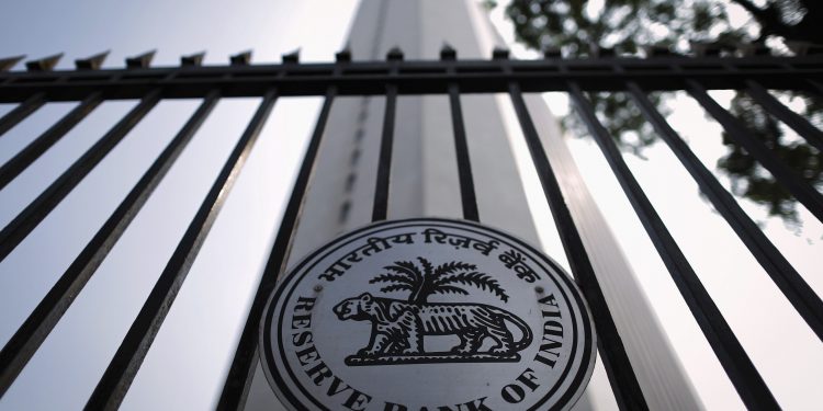 A view of the Reserve Bank of India (RBI) seal on a gate outside the RBI headquarters in Mumbai in this October 29, 2013 file photo. The bold monetary experiment that the Chinese and Indian central banks engaged in this year might one day be hailed as a success. So far, the result has been unprecedented market volatility and little else. To match story ASIA-ECONOMY/POLICY REUTERS/Danish Siddiqui/Files (INDIA - Tags: BUSINESS POLITICS LOGO)