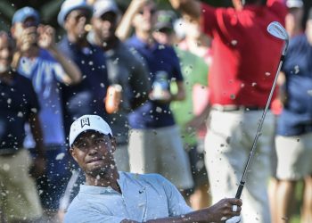 Tiger Woods hits up to the 13th green during the second round of the Tour Championship golf tournament in Atlanta, Friday   