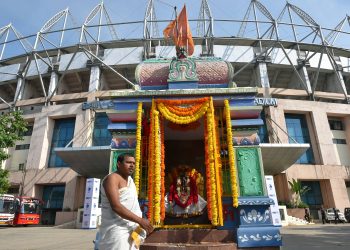 Priest Hamumanth Sharma stands outside the temple at Hyderabad cricket ground before the start of first day's play of second test match between India and West Indies, Friday