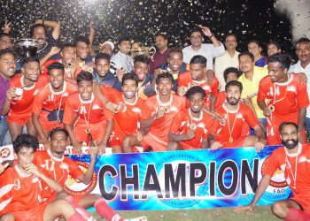 Sunrise Club players pose with the winners’ trophy and medals along with guests in Cuttack, Sunday   