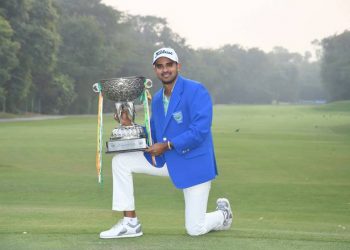 Khalin Joshi poses with the winner’s trophy at New Delhi, Sunday