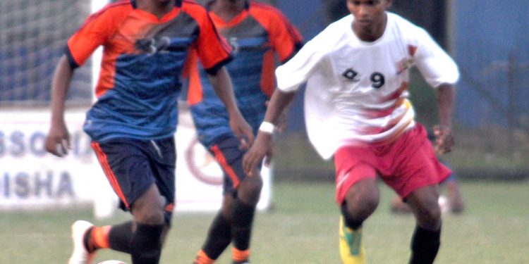 Rising Student Club and Young Utkal Club players in action during their match in Cuttack, Wednesday