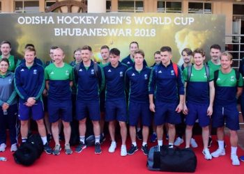 The Irish players and officials pose for a photograph after their arrival at the city airport, Sunday