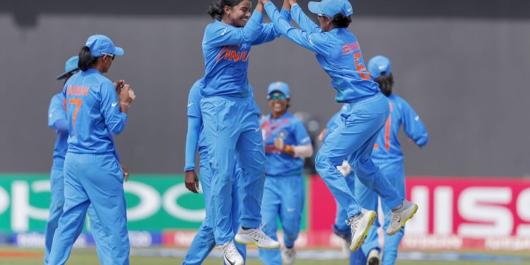 Indian players celebrate after the fall of a New Zealand wicket in Guyana, Friday  