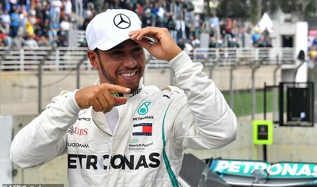 Lewis Hamilton gestures after grabbing the pole position in Sao Paulo, Saturday