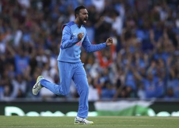 India's Krunal Pandya celebrates after taking the wicket of Ben McDermott during their third match in Sydney, Sunday