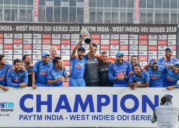 Ravindra Jadeja (with beard) is all smiles as he celebrates with teammates after dismissing a Windies batsman, Thursday