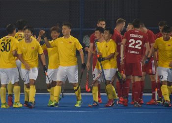 China players (in yellow) celebrate one of their goals against England at the Kalinga Stadium, Friday