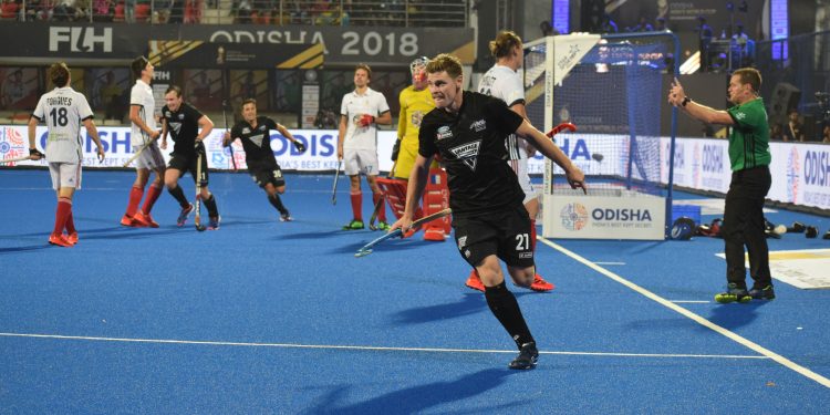 Stephen Jenness wheels away in celebration after scoring the winner against France at the Kalinga Stadium, Thursday