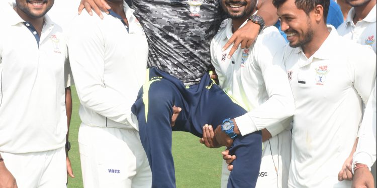 Odisha players carry Rajesh Mohanty on their laps after victory against Assam in Guwahati, Thursday   