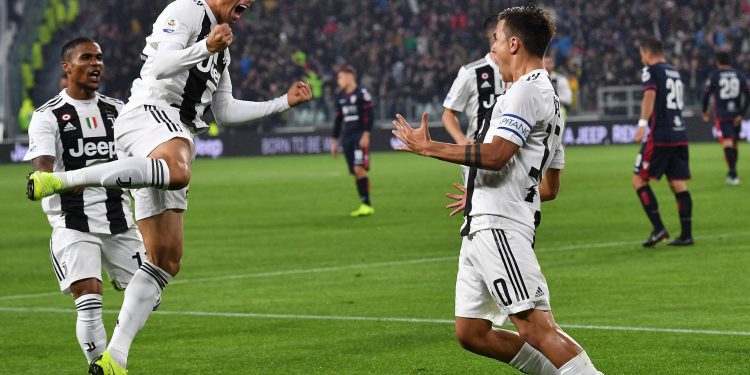 Paulo Dybala (R) celebrates with his teammates after scoring the opener for Juventus against Cagliari, Saturday 